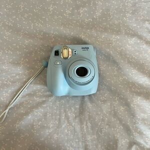 Instax Mini 7s camera and matching photo album. Hardly used. Great condition!